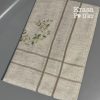 лляна скатертина на столі складена з вишивкою “Оливкові мотиви”, розмір 150×250 см